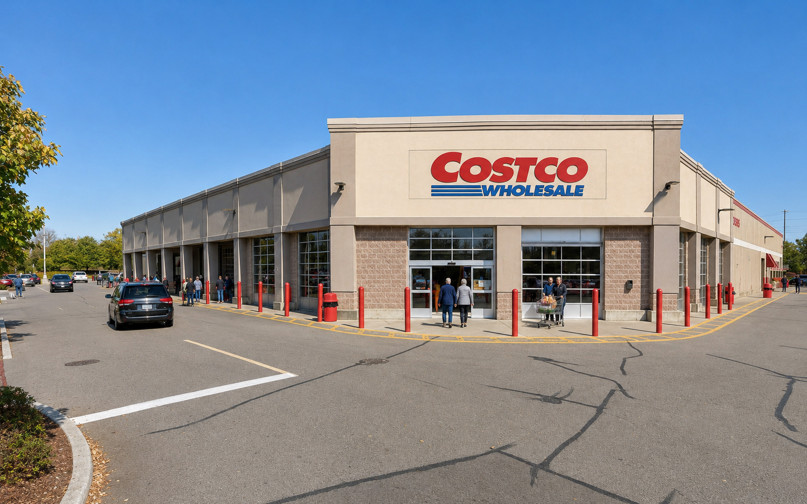 Costco storefront and entrance in a suburban shopping area.