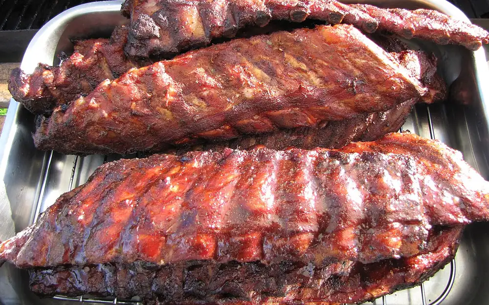 Barbecue ribs smoking over a pit