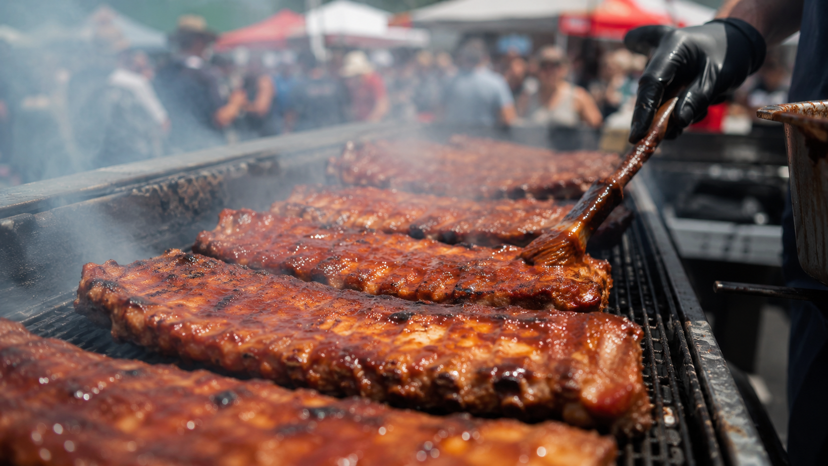 Ribs cooking on a grill at Burlington Ribfest.