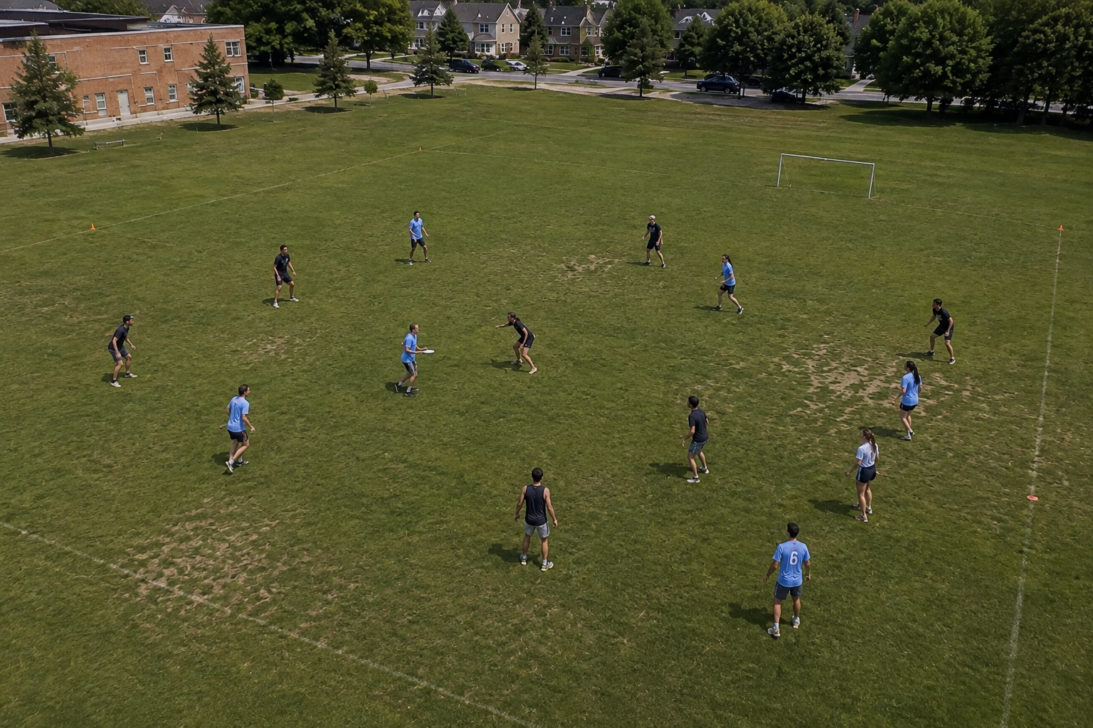 Burlington ultimate players on a grass field during a recreational game.